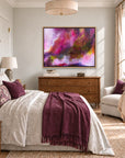 The Gift framed canvas print centred above a bedroom dressing table